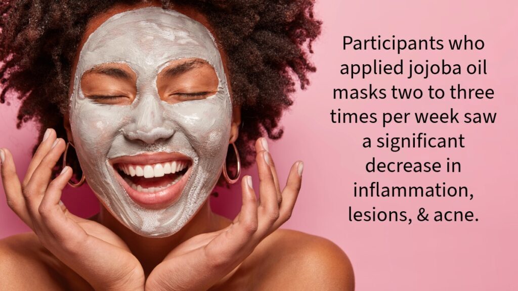 smiling dark skinned woman with a drying mask of clay and jojoba oil for acne covering her face 