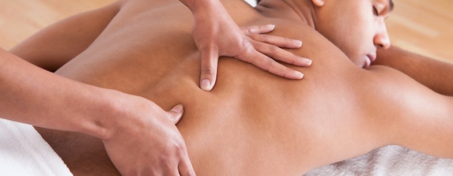 using 100% jojoba massage oil on back massage