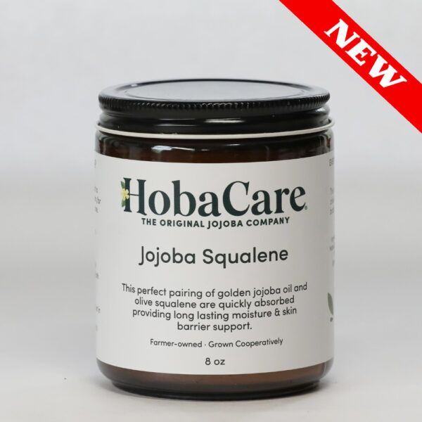 8 oz amber glass jar of jojoba squalene butter on light gray background