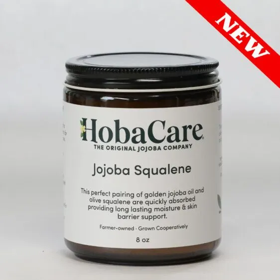 8 oz amber glass jar of jojoba squalene butter on light gray background