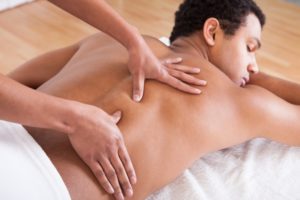 using 100% jojoba massage oil on back massage