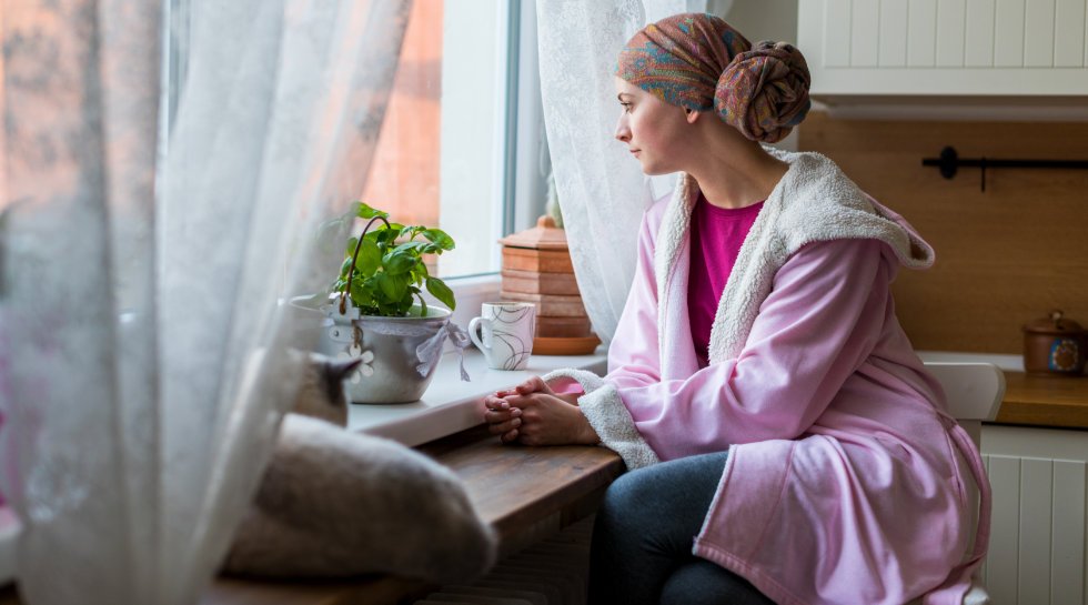 Oncology Patient Sits by a window