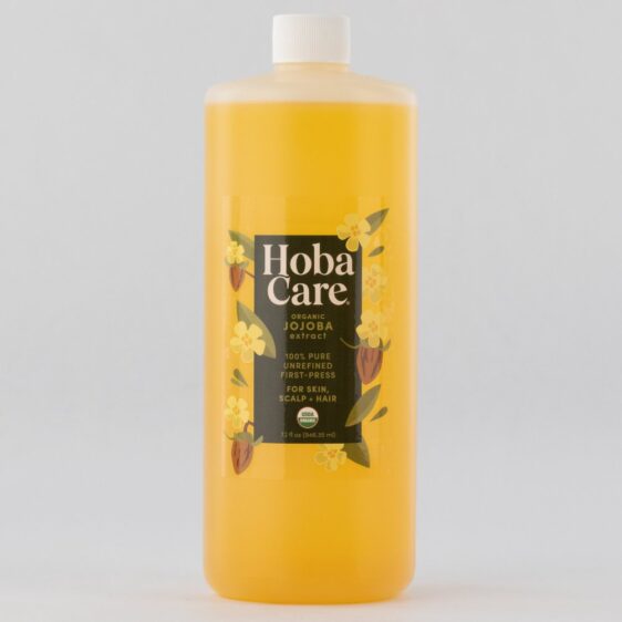 32 oz bottle of golden yellow HobaCare Jojoba Organic Carrier Oil on a gray background