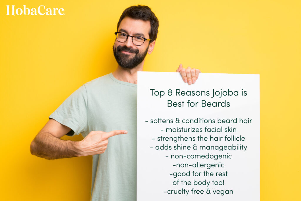 man on yellow background holding up sign stating the top 8 reasons jojoba is the perfect for beards
